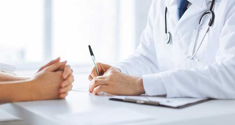 A doctor writing