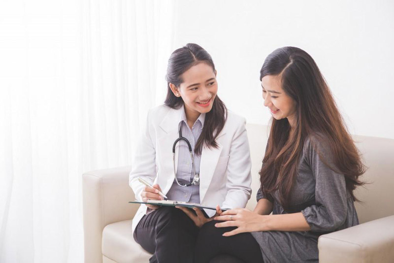 A woman consults with a doctor